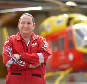 Dave Greenberg 'hero shot' standing in front of helicopter (2010)